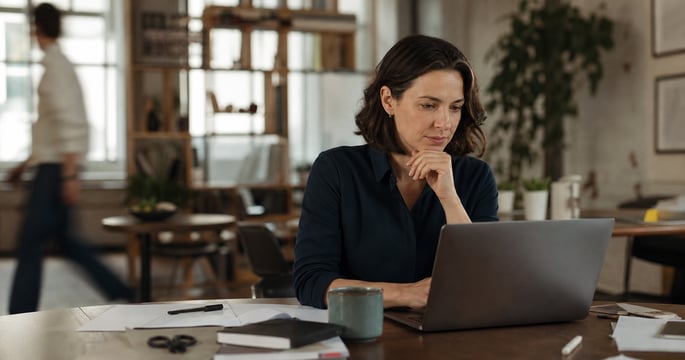 Professional working amid notifications, clutter and background distractions.